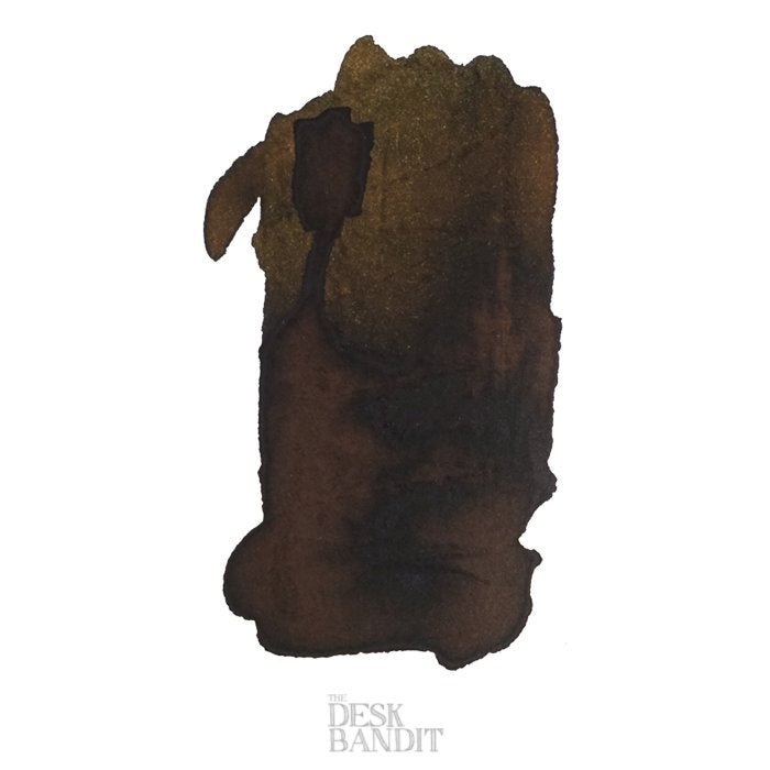 Ink swatch sample of Robert Oster Signature Ink, Bronze - 50ml, featuring a dark brown/black ink blot on white, showcasing its rich, dye-based hue.