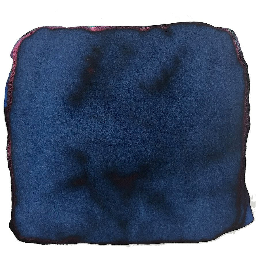 Close-up of Robert Oster's Carbon Fire ink swatch, showcasing dark blue hues with a reddish-purple sheen, reflecting the brand's unique Australian-inspired palette.