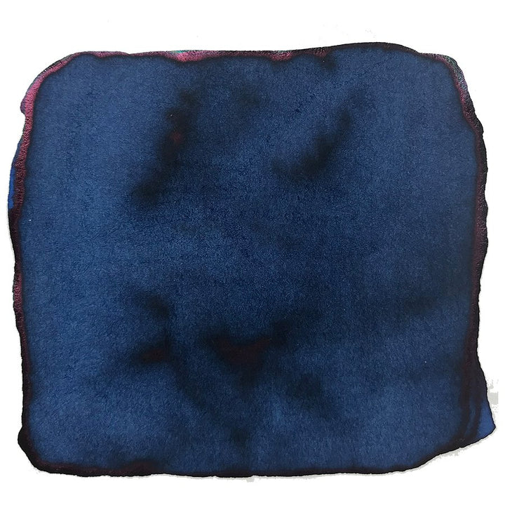 Close-up of Robert Oster's Carbon Fire ink swatch, showcasing dark blue hues with a reddish-purple sheen, reflecting the brand's unique Australian-inspired palette.
