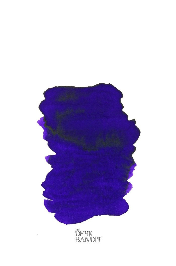Cassia (2ml) ink swatch, a rich dark blue-purple from Rohrer & Klingner, displayed on white paper with THE DESK BANDIT watermark.