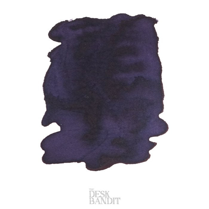 Charcoal - 2ml ink sample, deep blue-purple swatch with subtle shading, branded THE DESK BANDIT, representing Robert Oster's dye-based fountain-pen ink.