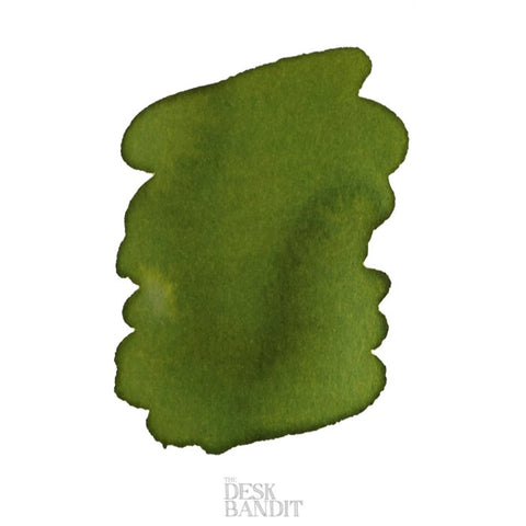 Abstract olive-green ink swatch on white, featuring Pilot's Iroshizuku Ink - Chiku-Rin (2ml) sample, inspired by Japanese bamboo forests, with The Desk Bandit watermark.