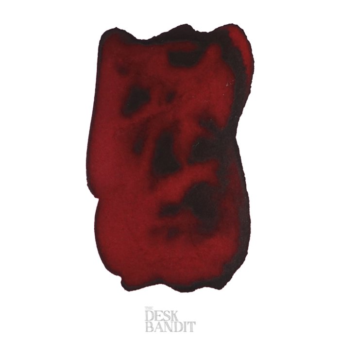 Clay Red - 50ml ink swatch on white paper, showcasing a rich maroon shade. THE DESK BANDIT logo visible, part of Robert Oster's exclusive collection.