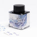Fanyantan Cloud Pavilion 2ml fountain pen ink sample, in a square glass bottle with a watercolor stag label, showcasing Desk Bandit’s innovative ink offerings.