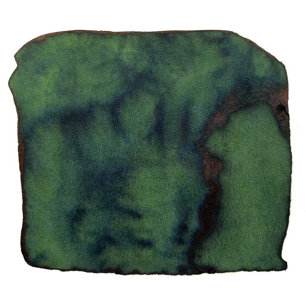 Crocodile Green - 50ml ink swatch displays deep green with teal-blue shading and a rusty brown rim, showcasing wet-on-wet granulation typical of Robert Oster Signature Inks.