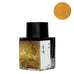 Deer's Song fountain pen ink by Fanyantan, 20ml glass bottle, features a golden deer landscape label. Shimmery yellow-gold ink color swatch included in the image.