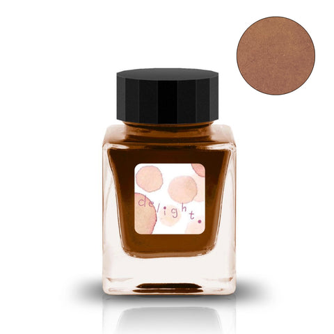 30ml jar of Tono & Lims delight ink, featuring an earth orange-brown hue, with a decorative label and matching color swatch.