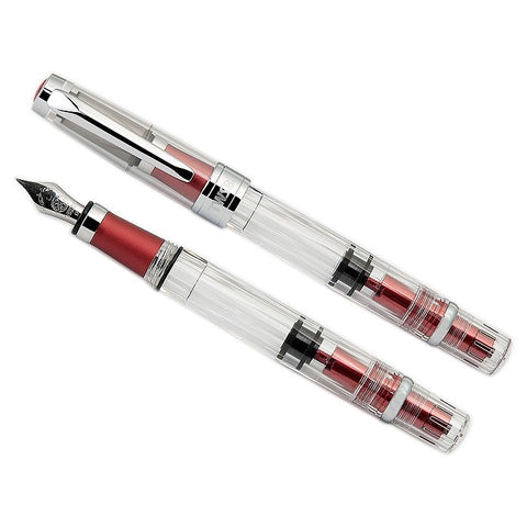 Diamond 580AL (Rose Red) - Medium demonstrator fountain pens, clear barrels reveal piston mechanism; red-metal accents, polished metal caps, steel nibs.