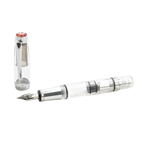 Diamond Mini AL (Silver) - Stub 1.1 fountain pen with clear barrel, showing piston mechanism, stainless-steel nib, and matching transparent cap with metal clip and red emblem.