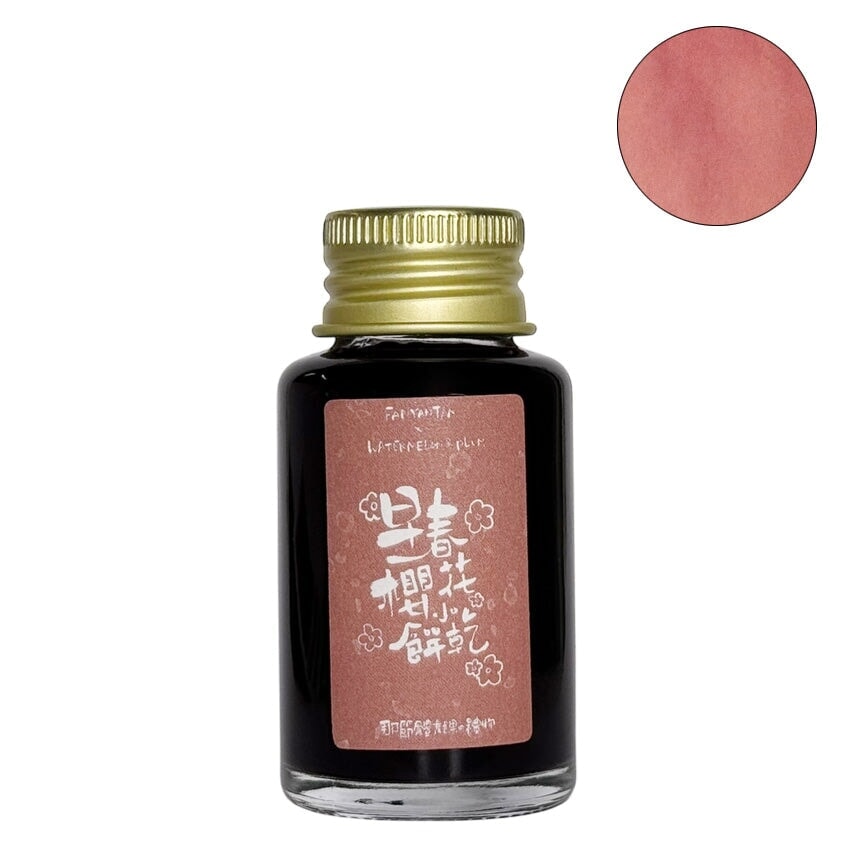 Fanyantan Early Spring Cherry Blossom Cookies fountain pen ink, 30ml glass bottle with a coral-pink hue, adorned with cherry-blossom themed label featuring stylized Chinese characters.