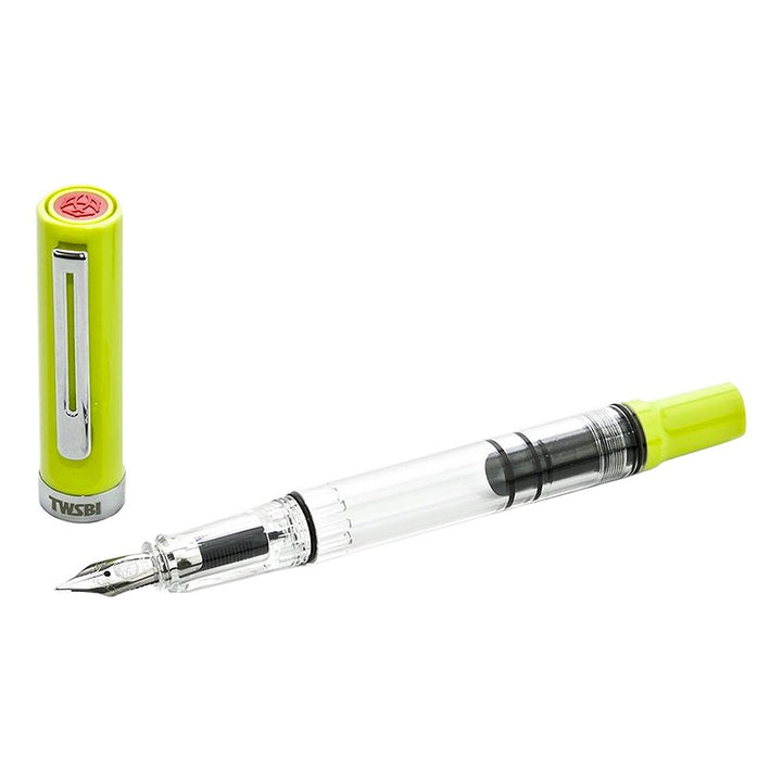 ECO-T (Yellow Green) - Fine fountain pen with clear barrel showing piston mechanism; cap in bright lime/yellow with chrome clip and TWSBI branding.