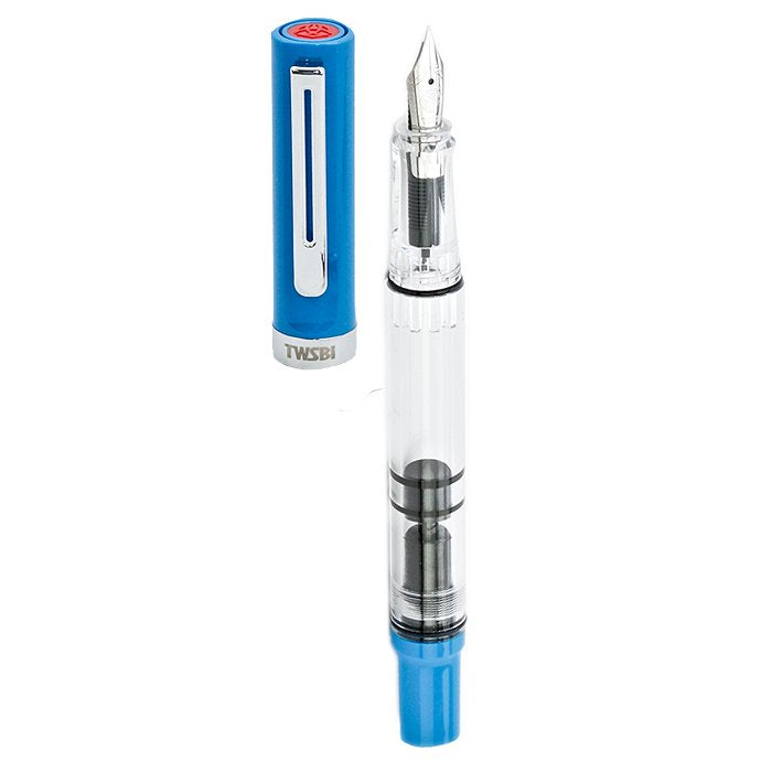 ECO-T (Blue) - Medium fountain pen with a transparent barrel, visible piston mechanism, steel nib, and separate blue cap with TWSBI imprint.