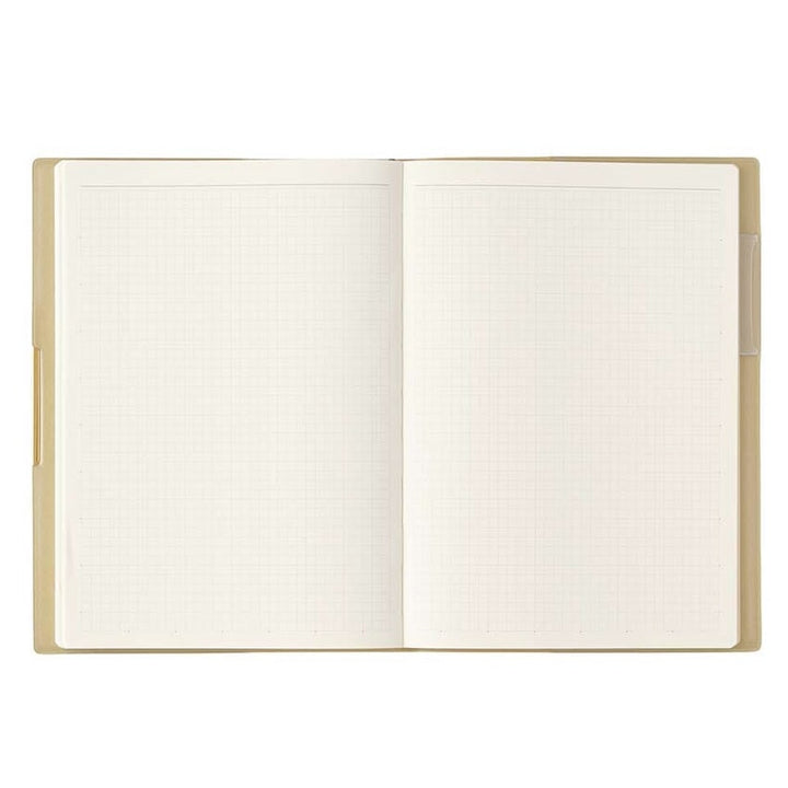 NOLTY 2026 Ecri Plus 7 Weekly Planner - B6, open to blank light-grey grid pages. Beige cover. Ideal for fountain pen friendly note-taking. Made in Japan.