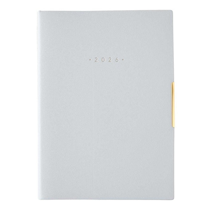 NOLTY 2026 Ecri Plus 8 Weekly Planner - B6, features metallic 2026 on textured cover with gold-tone clasp, ideal for organizing with detailed layouts and Japanese quality craftsmanship.