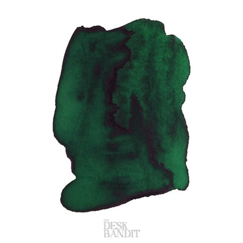 Emerald - 2ml ink sample by Robert Oster, showcasing a dark green swatch with subtle shading and sheen, featuring The Desk Bandit watermark.