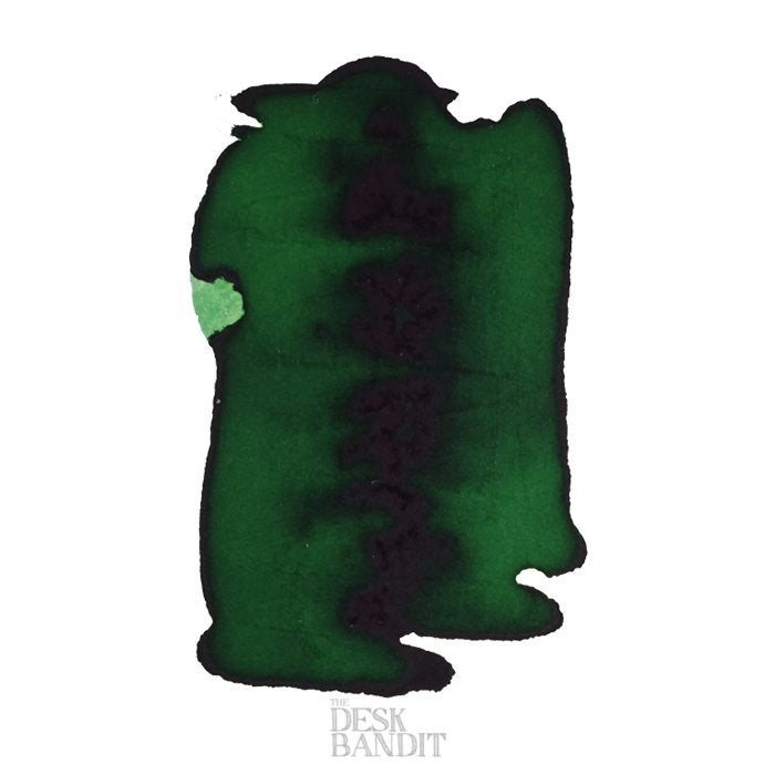 Ever Green - 2ml ink sample, deep green with dark sheen, displayed as an abstract swatch on paper, from The Desk Bandit's fountain-pen ink collection.