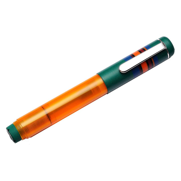 OPUS 88 Fantasia - Green (Broad), featuring a transparent amber-orange barrel, matte green cap with silver clip, and multicolored stripes, showcasing an elegant design.