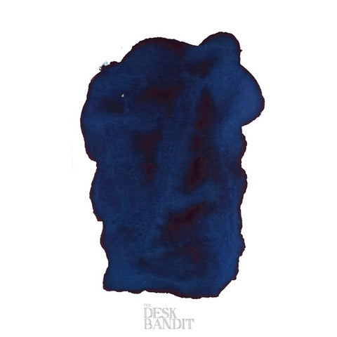 Frankly Blue - 2ml ink sample, showcasing dark-blue swatch with watery edges on white paper, featuring THE DESK BANDIT watermark at the bottom.