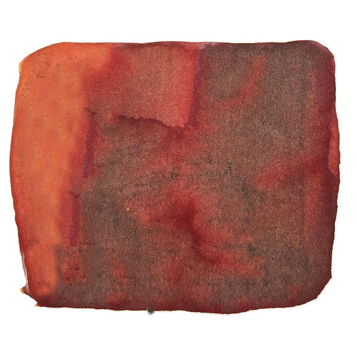Abstract swatch of warm, rusty-red/brown pigment representing Colorverse&
