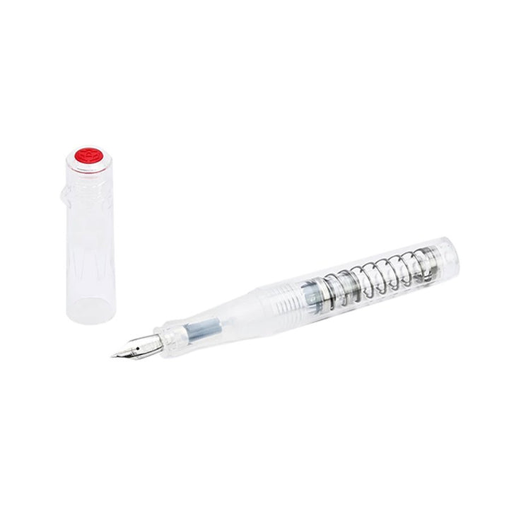GO (Clear) - Extra Fine fountain pen with visible nib section, transparent ink converter, and spring piston mechanism, shown with snap-on cap beside it.