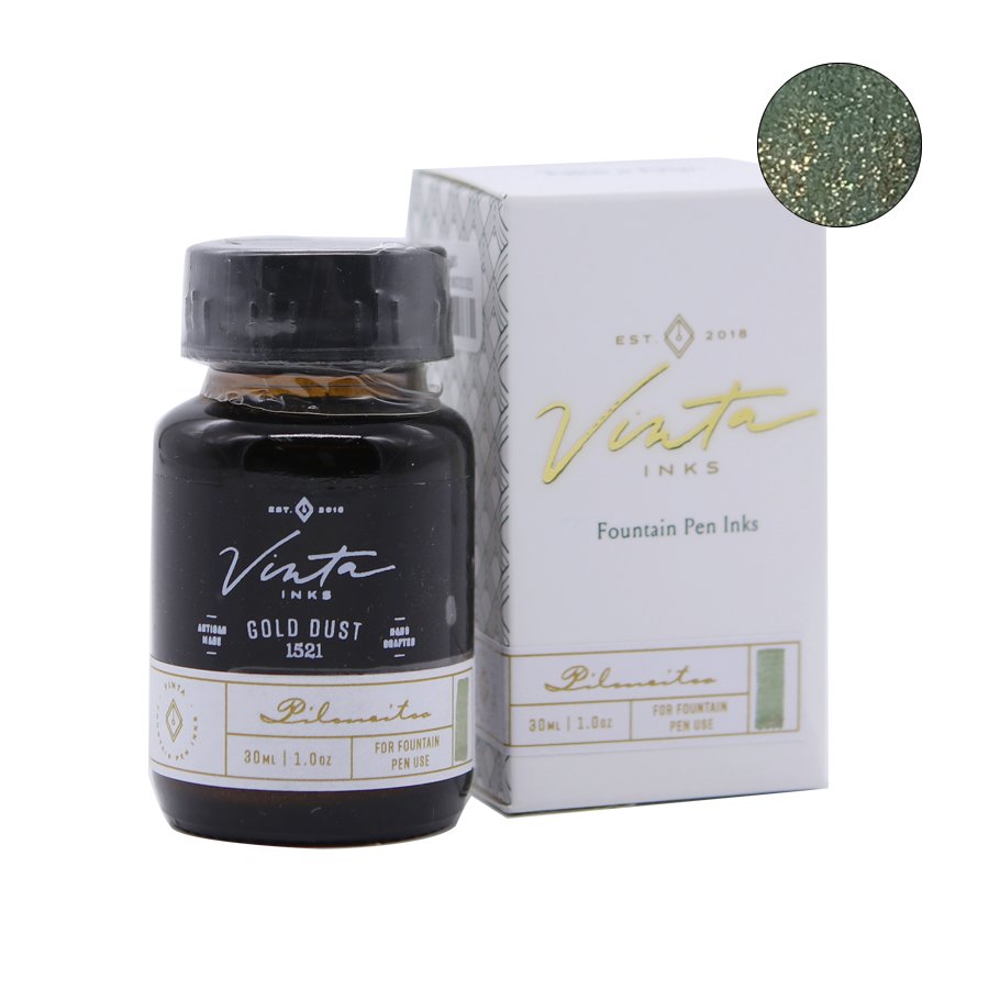 A 30 ml bottle of Vinta Inks' Gold Dust (Piloncitos 1521) with a dark greenish hue and gold shimmer, displayed beside its retail box.