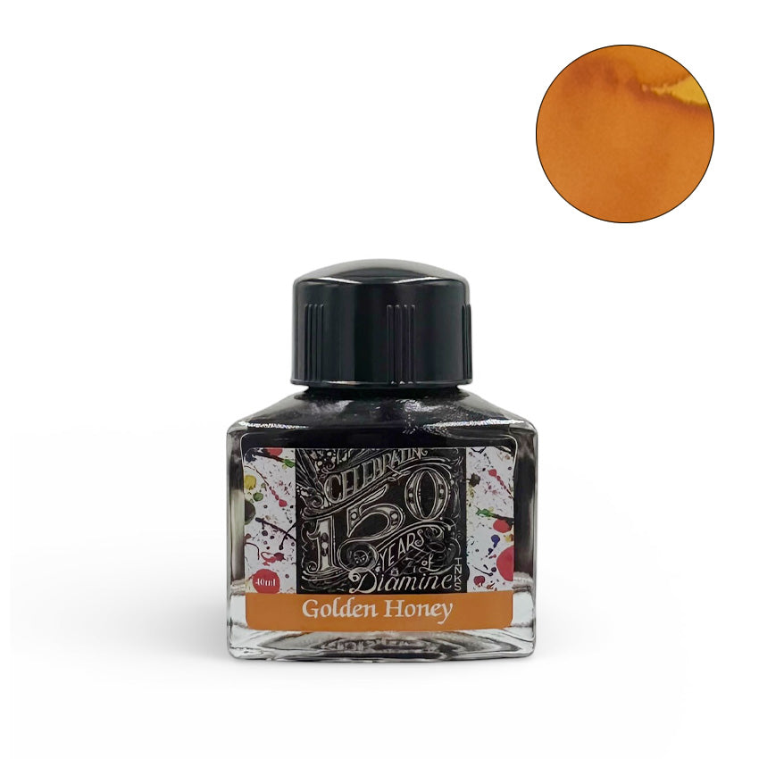 Diamine Golden Honey (150th Anniversary) 40ml fountain pen ink in a triangular glass bottle with a decorative label, featuring a warm honey-gold tone.