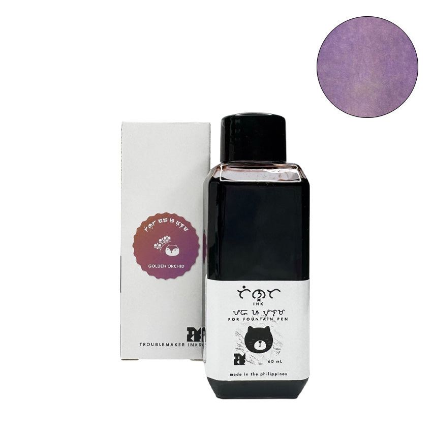 Golden Orchid - 2ml ink sample, purple-tinted, from Troublemaker Inks, features a stylized cat head on the label, showcasing its unique, vibrant color.