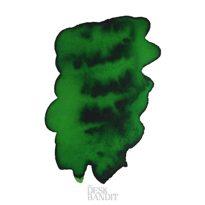 Green Green - 2ml ink sample by Robert Oster on white paper with darker shading, showcasing The Desk Bandit watermark.