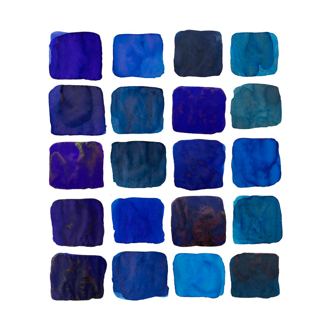 Ink Studio Sampler Set - 100 colours showcases 20 blue watercolor swatches, arranged in a grid, highlighting texture and variety from deep navy to bright cerulean.