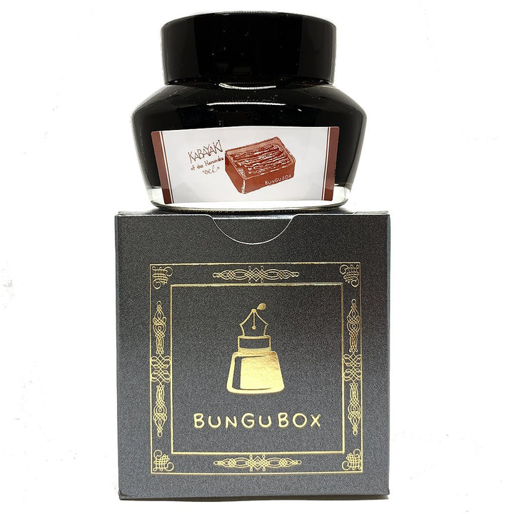 Bungubox Kabayaki - 2ml ink bottle on a decorated charcoal-grey box, featuring an eel dish label, stylized logo, and gold foil details.