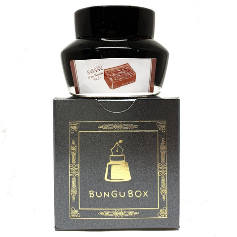 Bungubox Kabayaki - 50ml ink in a squat glass bottle with grilled eel illustration, atop its decorative box packaging, renowned for enhancing writing pleasure.