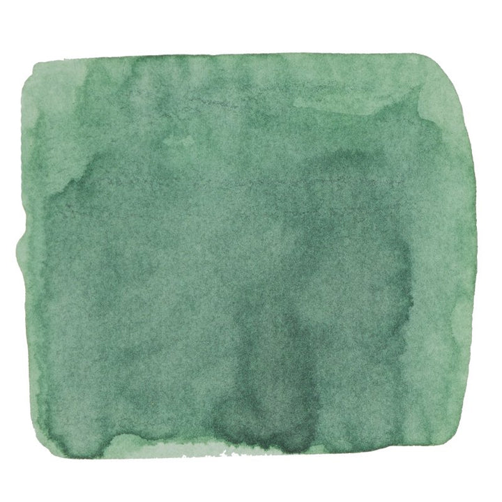 Green watercolor swatch representing Tono & Lims' Kagawa (Peaceful Time) ink, 30ml, with softly feathered edges, showcasing its dye-based, abstract mottled tones.