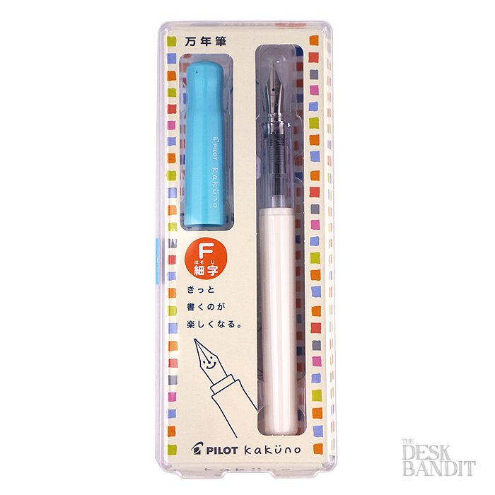 Pilot Kakuno - Soft Blue - Fine fountain pen in original packaging, featuring a white barrel, translucent grip, blue cap, and fine stainless steel nib. Includes black cartridge.