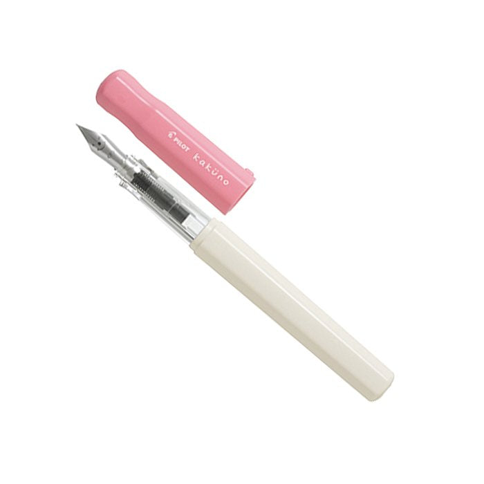 Pilot Kakuno - Soft Pink - Extra Fine fountain pen with a pink cap, translucent grip, and cream barrel, showcasing a durable stainless-steel nib.