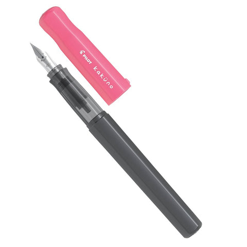 Pilot Kakuno fountain pen with medium steel nib, featuring a distinctive pink cap and dark gray barrel, ideal for beginners. Includes a black ink cartridge.