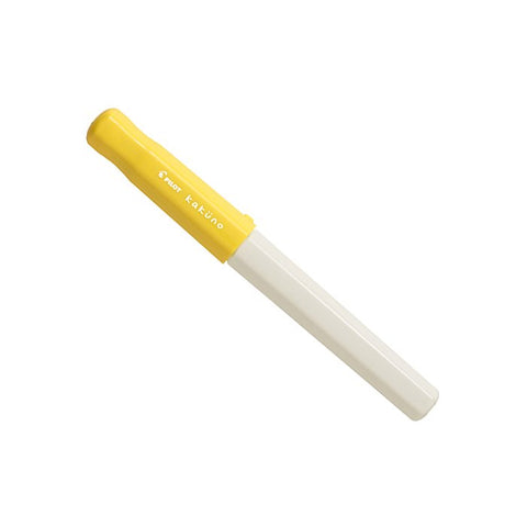 Pilot Kakuno fountain pen features a yellow cap, off-white barrel, and extra fine stainless steel nib. Ideal for beginners with its durable, lightweight design.