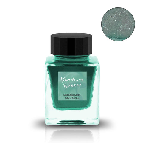 Kamakura Breeze (Shimmer) - 30ml glass bottle of green-turquoise ink with sparkles, labeled “YUCO CASE.” Includes magnified sparkle swatch. Part of Tono & Lims 'Friendship' series.