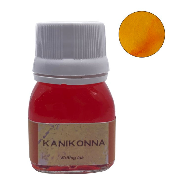 Kanikonna - 20ml glass bottle of Krishna Ink, filled with vibrant orange-red dye. Includes a circular swatch showing its warm golden-orange tone on paper.