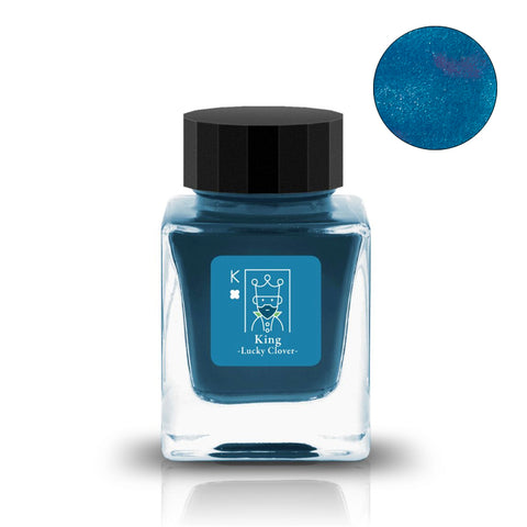 Square glass ink bottle with black cap, labeled King – Lucky Clover, containing teal-blue shimmer ink by Tono & Lims, featuring a playing-card King icon.
