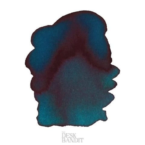 Iroshizuku Ink - Ku-Jaku (2ml) sample, showing a teal-green swatch with a burgundy sheen, on a white background with The Desk Bandit watermark.