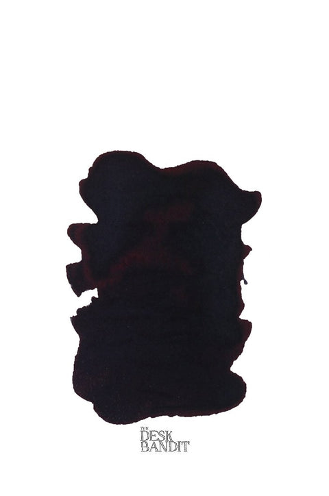 Leipziger Schwarz (2ml) ink swatch displays an amorphous, dark pool on white, with THE DESK BANDIT logo beneath, showcasing Rohrer & Klingner's hand-crafted quality.