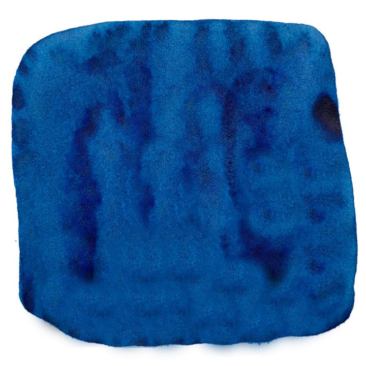 Lermontov - 88ml: A deep blue watercolor-like swatch representing Noodler's Ink, known for its diverse, water-resistant, and fade-resistant ink range.