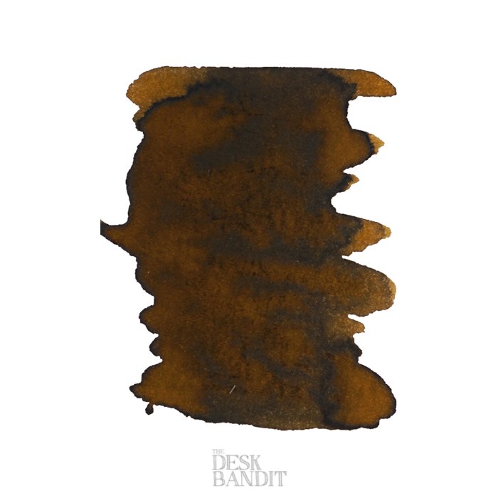 Marrone Mustard - 2ml ink sample, dark brown blot on white, featuring The Desk Bandit watermark, representing Robert Oster's dye-based ink.