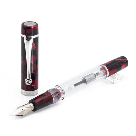 Planet Series (Mars) - Medium fountain pen, demonstrator-style, uncapped, showcasing a transparent barrel with visible piston-filling mechanism, red-and-black marbled cap, and silver-colored trim and nib.