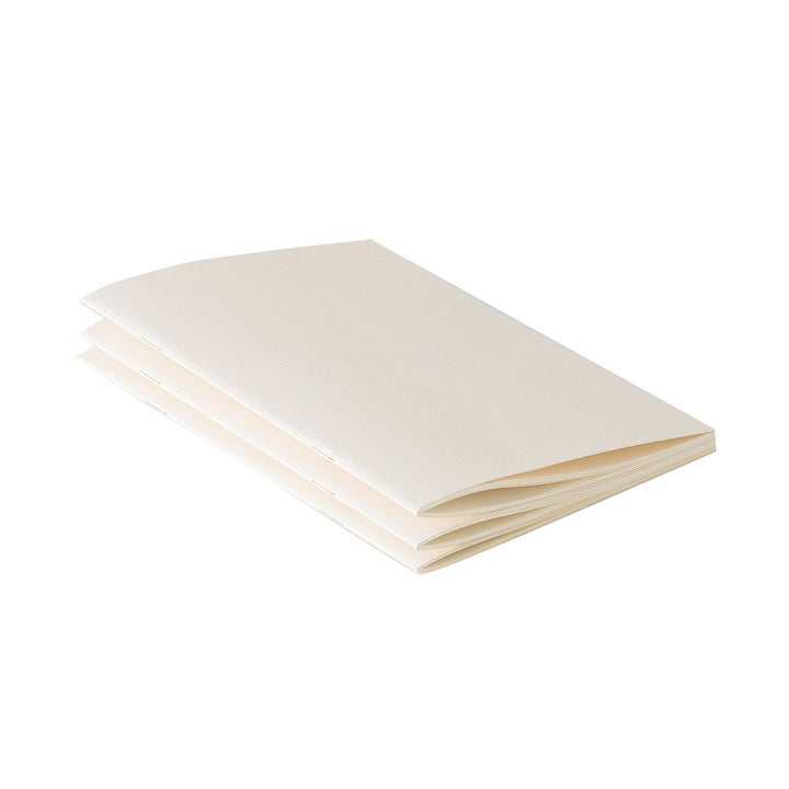 MD Notebook Lite - A5 Lined/Ruled (3 pack), featuring slim, cream-colored, stitched booklets with plain covers, ideal for jotting down inspirations. Includes index stickers.