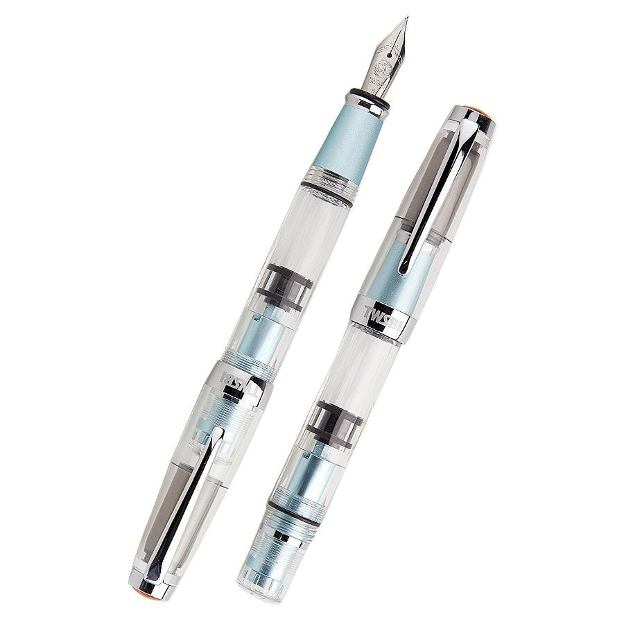 Diamond Mini AL (Mint) - Extra Fine fountain pens with clear barrels, silver-tone accents. One capped, one uncapped showing steel nib, pale blue grip and end caps.