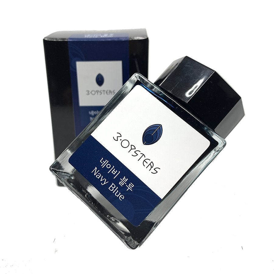 Navy Blue - 2ml fountain pen ink by 3Oysters in a small glass bottle, displayed with its matching box from the Delicious series.