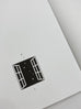 Nebula A5 notebook with blank pages, featuring a cover design of an open window with star shapes. Includes guide card for lined or gridded use.
