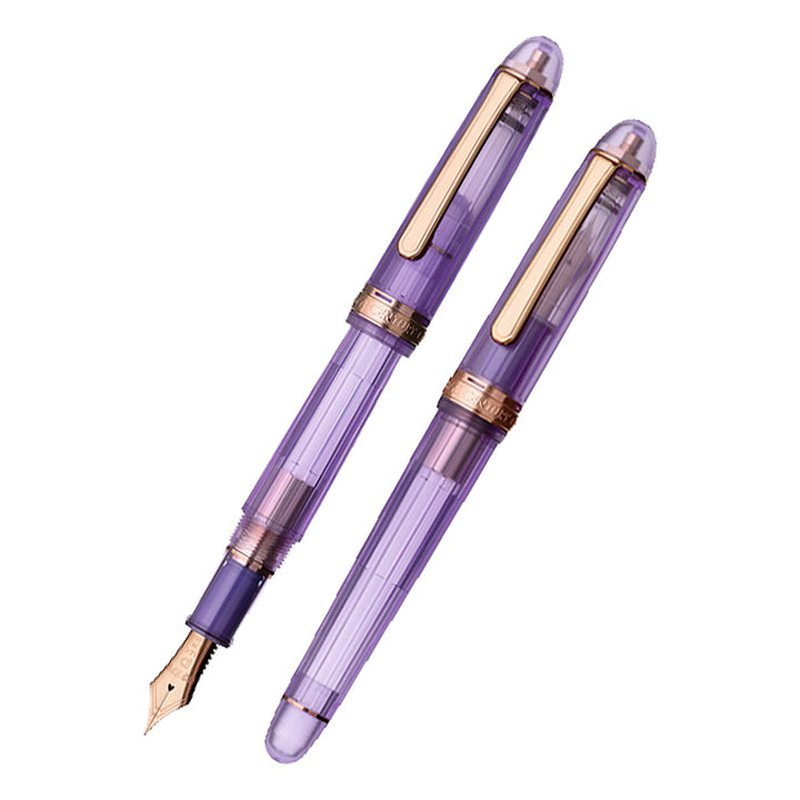Two translucent purple #3776 Century Nice Lavande fountain pens with rose-gold trim; one capped, the other uncapped showing a broad 14K gold nib.