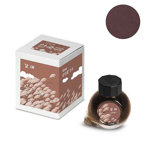 15ml bottle and carton of Colorverse Project Ink No.073 Common Reed, featuring a reed field design, highlighting its plant-based, eco-friendly composition and smooth flow.